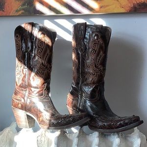 Brown cowboy boots with brass studs